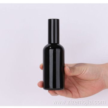 Empty black glass spray bottle with pump